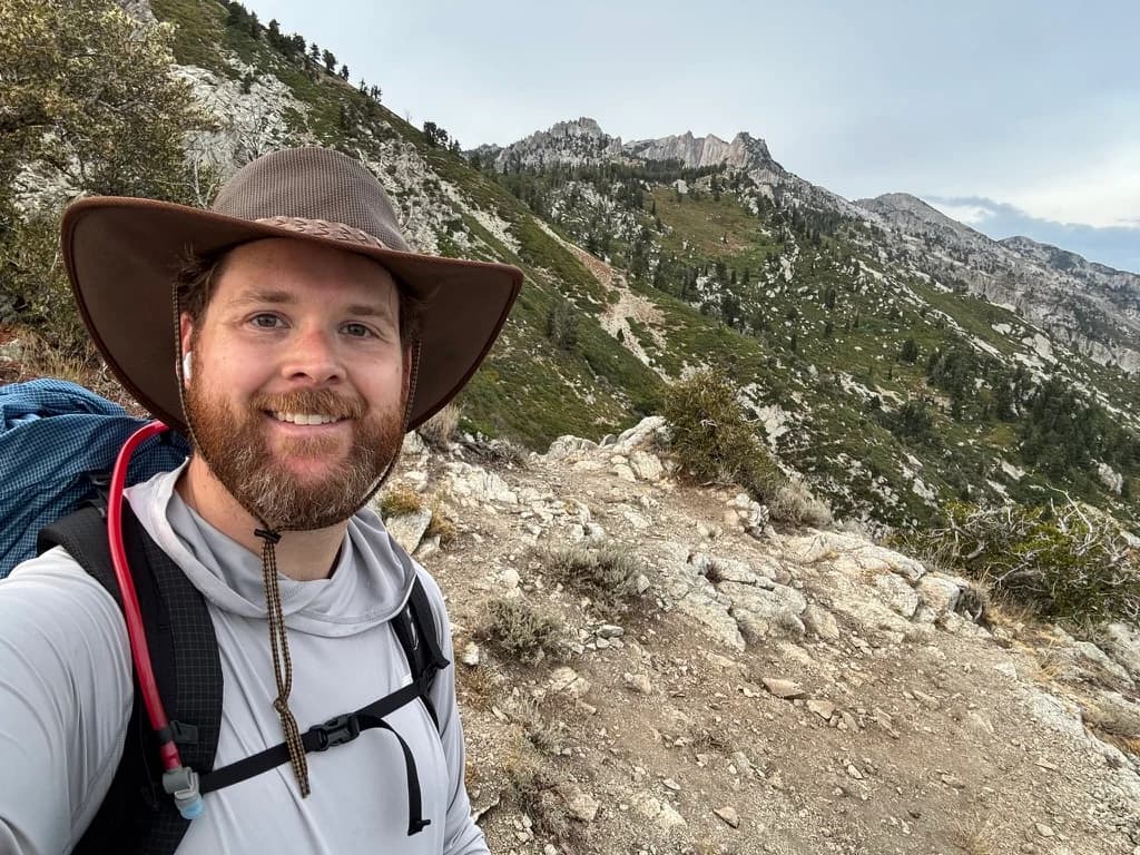 Brad Perkins hiking in the mountains